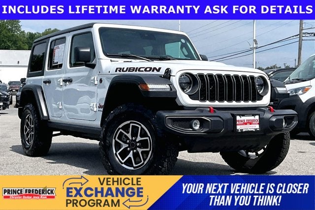 2025 Jeep Wrangler 4-Door Rubicon 4x4 in Bright White Clearcoat — front three-quarter view