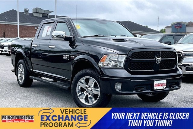 2015 RAM 1500 Outdoorsman in Brilliant Black Crystal Pearlcoat — front three-quarter view