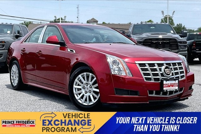 2012 Cadillac CTS Luxury in Crystal Red Tintcoat — front three-quarter view