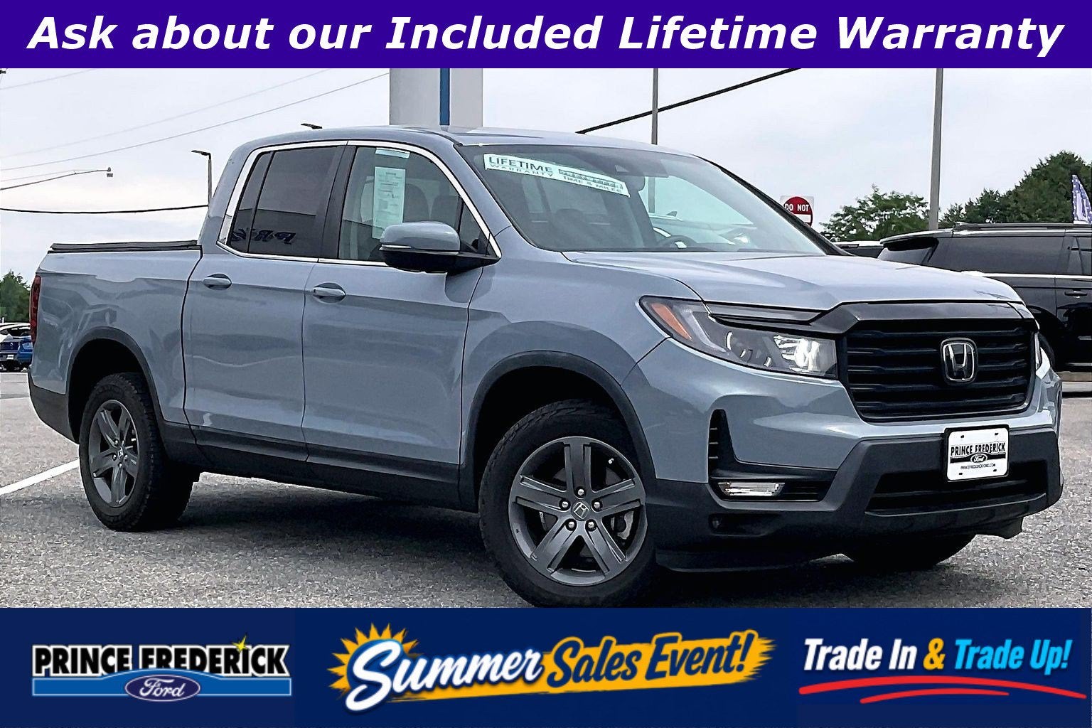 2023 Honda Ridgeline RTL in Silver — front three-quarter view