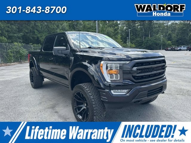 2021 Ford F-150 XLT in Agate Black Metallic — front three-quarter view