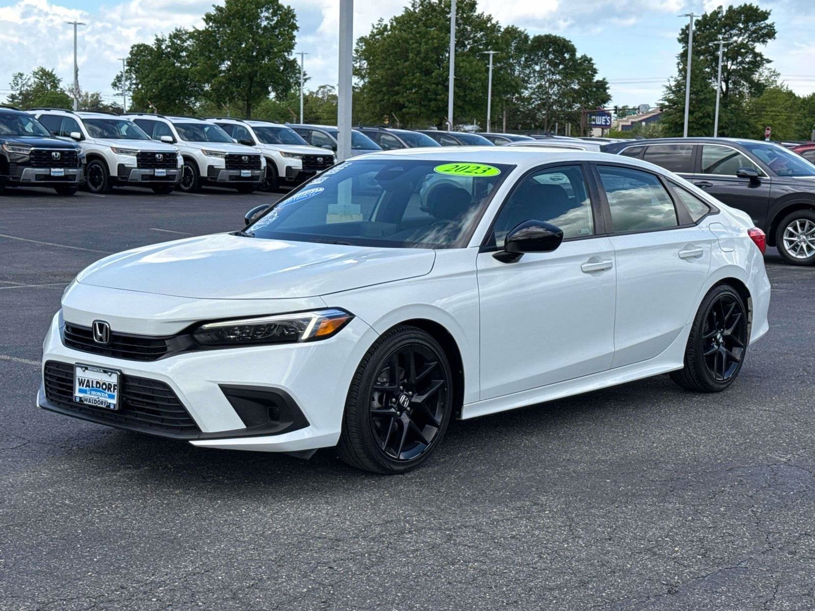 2023 Honda Civic Sedan — rear three-quarter view