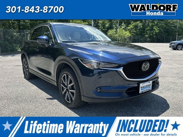 2018 Mazda Mazda CX-5 Grand Touring in Deep Crystal Blue Mica — front three-quarter view
