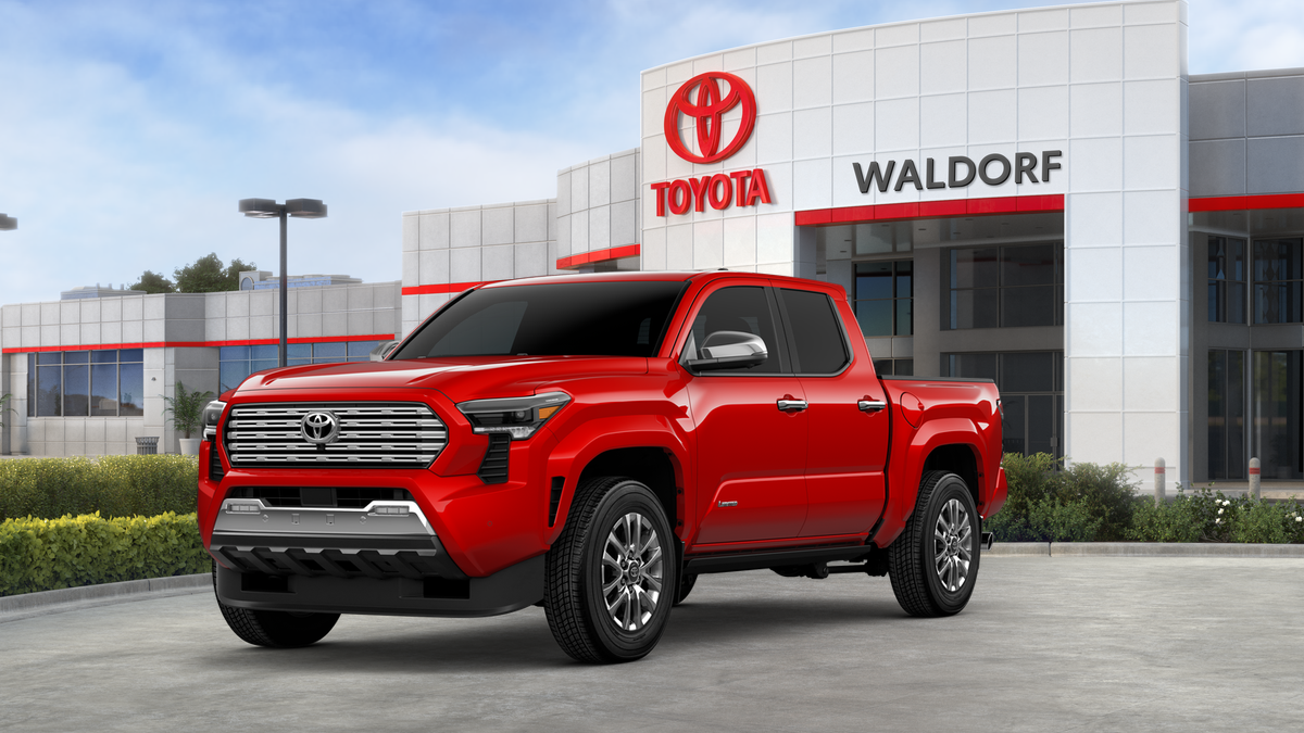 2026 Toyota Tacoma Limited in Supersonic Red — front three-quarter view