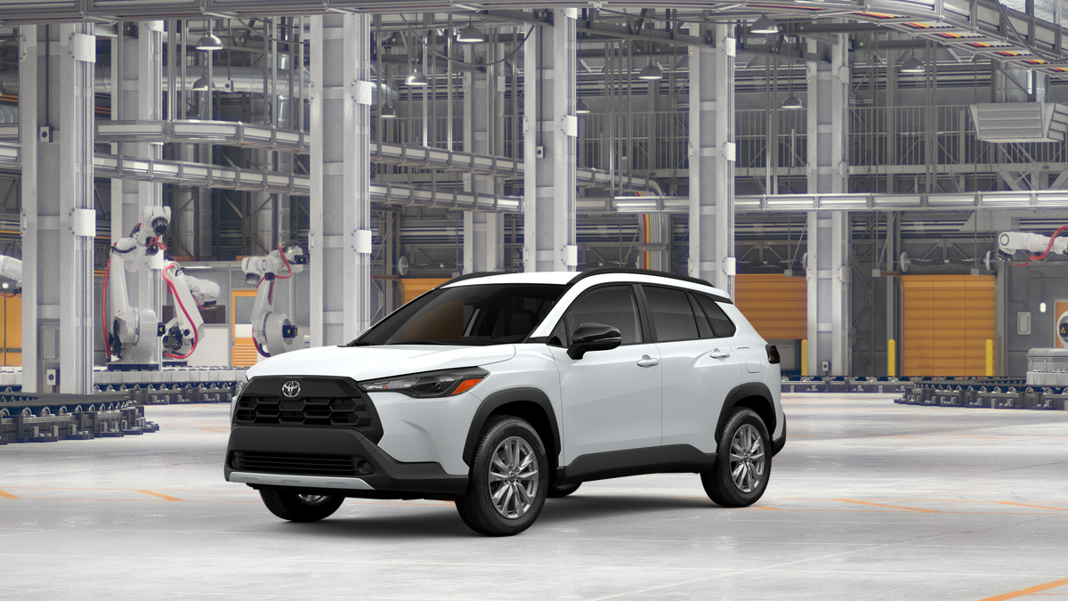 2026 Toyota Corolla Cross LE in Wind Chill Pearl — front three-quarter view